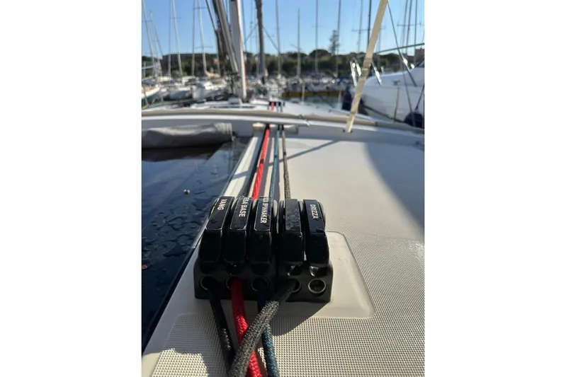 Margaret Yacht Photos Pics 2014 Beneteau Oceanis 48 sailboat deck with labeled rope clutches in marina.