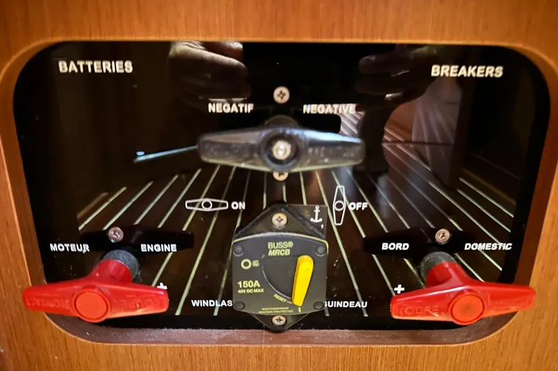 Margaret Yacht Photos Pics Control panel of a 2014 Beneteau Oceanis 48 sailboat, featuring battery and breaker switches.