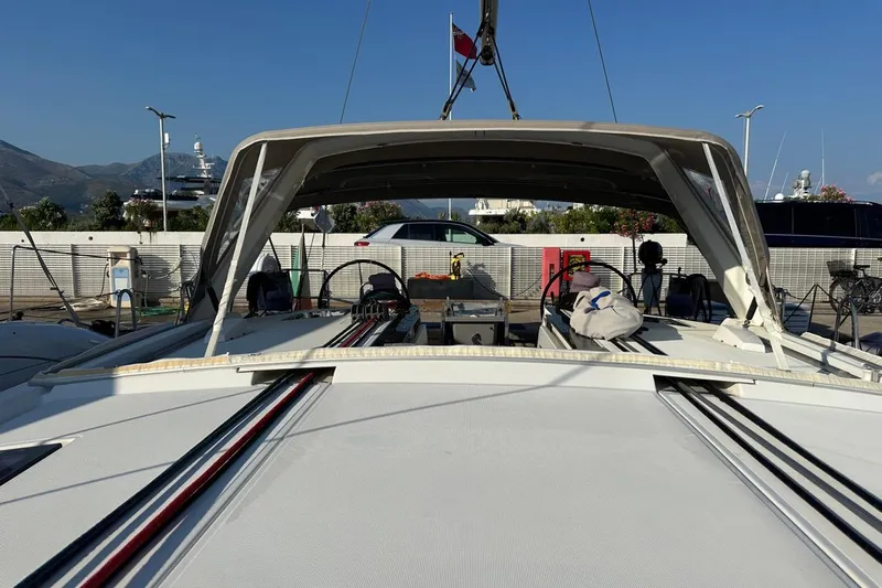 Margaret Yacht Photos Pics 2014 Beneteau Oceanis 48 yacht docked, showcasing cockpit and helm area.