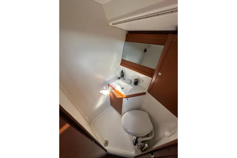 Margaret Yacht Photos Pics 2014 Beneteau Oceanis 48 yacht bathroom with sink, mirror, and toilet.