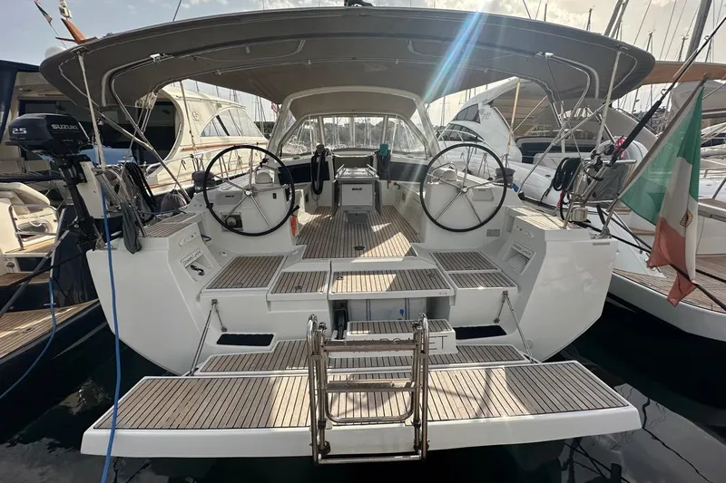 Margaret Yacht Photos Pics 2014 Beneteau Oceanis 48 yacht with dual steering wheels, docked in a marina.