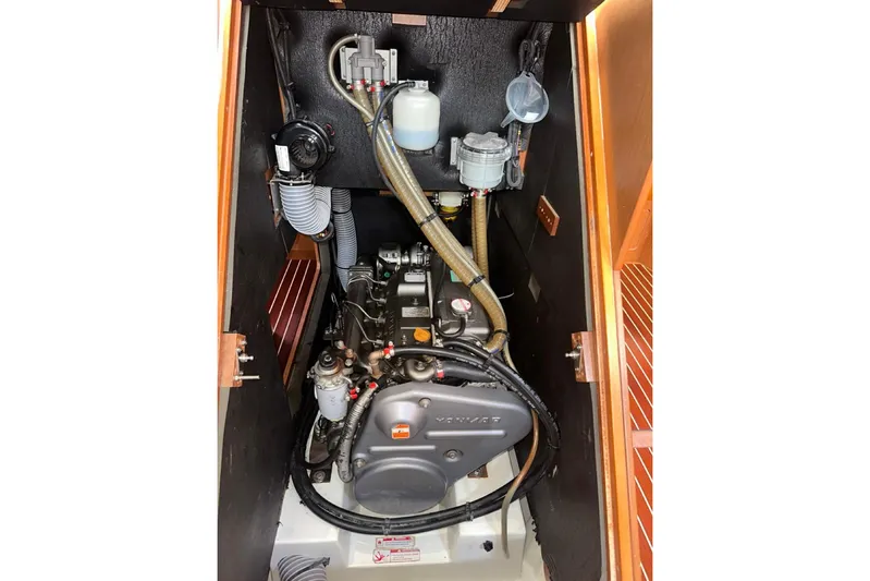 Margaret Yacht Photos Pics Engine compartment of a 2014 Beneteau Oceanis 48 sailboat, showcasing mechanical components.