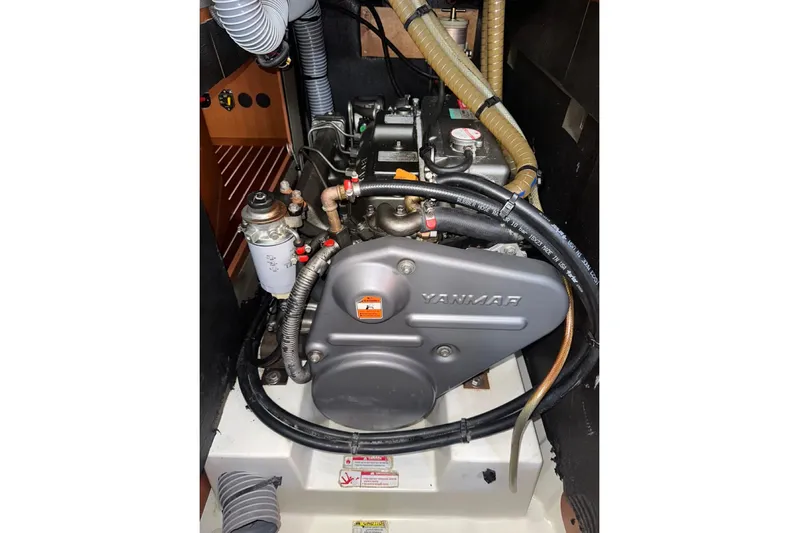 Margaret Yacht Photos Pics Engine compartment of a 2014 Beneteau Oceanis 48 sailboat, featuring a Yanmar engine.