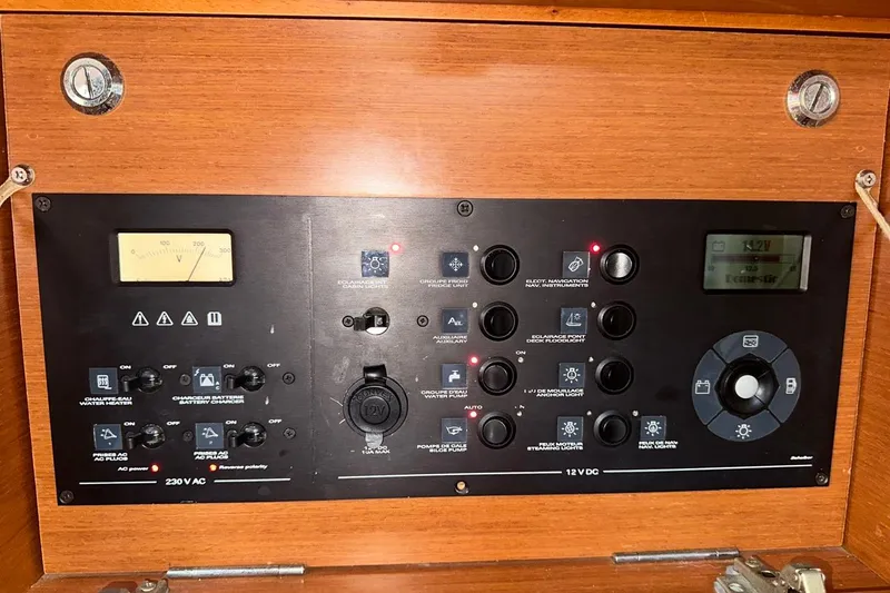 Margaret Yacht Photos Pics Control panel of a 2014 Beneteau Oceanis 48 sailboat, featuring various switches and gauges.