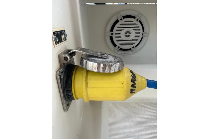 Margaret Yacht Photos Pics Yellow power connector on 2014 Beneteau Oceanis 48 sailboat, near speaker.