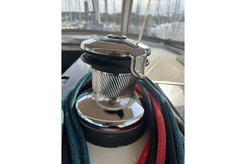 Margaret Yacht Photos Pics Close-up of a winch with ropes on a 2014 Beneteau Oceanis 48 sailboat.