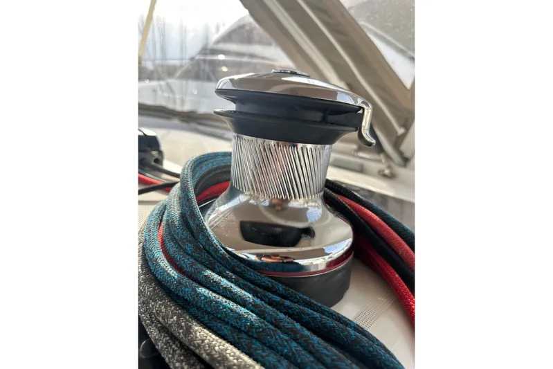 Margaret Yacht Photos Pics Close-up of a winch with ropes on a 2014 Beneteau Oceanis 48 sailboat.
