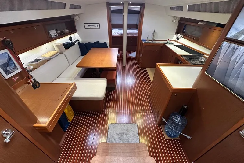 Margaret Yacht Photos Pics Interior of 2014 Beneteau Oceanis 48 yacht with wood finish and modern amenities.