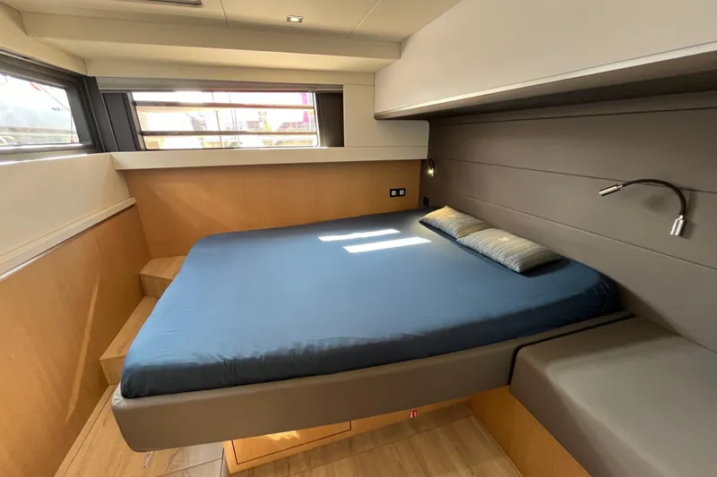 Dimemar Yacht Photos Pics Luxurious cabin interior of 2021 Privilege 580 SIGNATURE yacht with modern design and cozy bed.