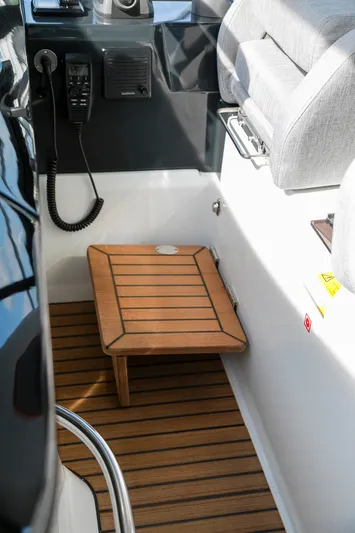  Yacht Photos Pics 2025 Beneteau Gran Turismo 45 cockpit with wooden flooring and seating.