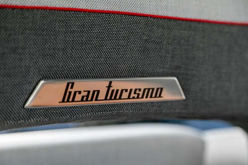  Yacht Photos Pics Close-up of 2025 Beneteau Gran Turismo 45 logo on textured fabric background.