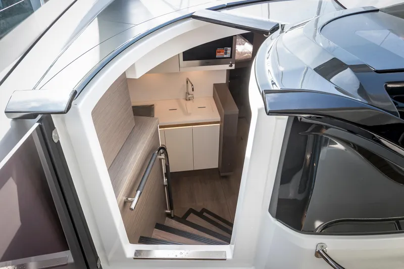  Yacht Photos Pics Interior view of 2025 Beneteau Gran Turismo 45 yacht, featuring modern kitchen and sleek design.
