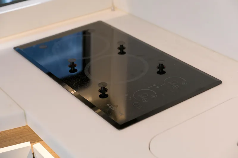  Yacht Photos Pics Modern stovetop on Beneteau Gran Turismo 45 yacht, 2025 model, featuring sleek design.