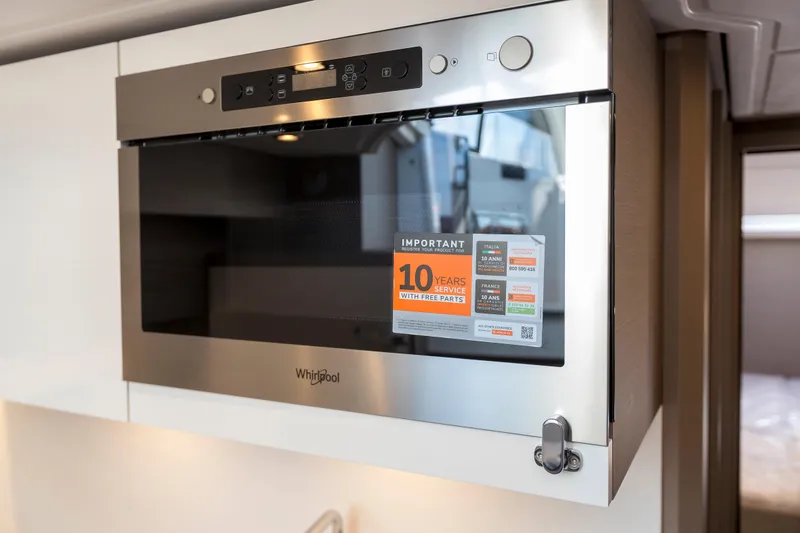  Yacht Photos Pics Built-in Whirlpool microwave in 2025 Beneteau Gran Turismo 45 yacht kitchen.