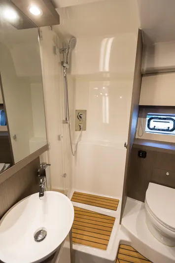  Yacht Photos Pics Luxurious bathroom in 2025 Beneteau Gran Turismo 45 yacht with modern fixtures and elegant design.
