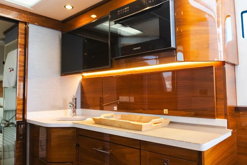 Galati Yacht Sales Trade Yacht Photos Pics Luxurious 2024 Valhalla V-55 boat interior with modern kitchen amenities.