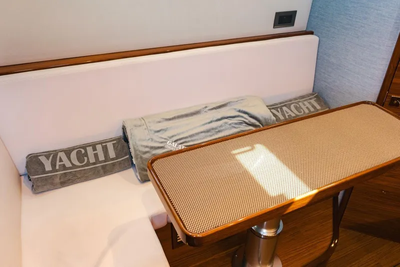 Galati Yacht Sales Trade Yacht Photos Pics 2024 Valhalla V-55 yacht interior with cushioned seating and table.