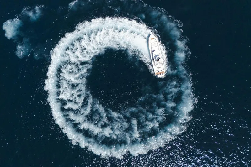 Galati Yacht Sales Trade Yacht Photos Pics Aerial view of 2024 Valhalla Boatworks V-55 creating a circular wake pattern.