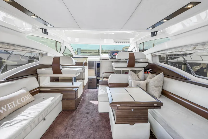 Liquidity Yacht Photos Pics Luxurious interior of 2012 Azimut 48 Flybridge yacht with modern seating and elegant decor.
