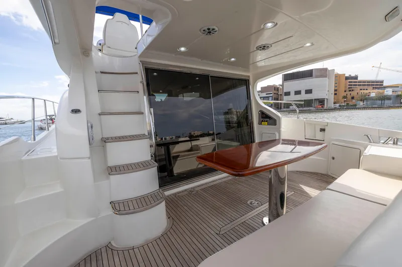 Liquidity Yacht Photos Pics 2012 Azimut 48 Flybridge yacht with spacious deck and modern amenities.