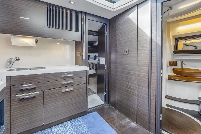 Liquidity Yacht Photos Pics Modern kitchen and bathroom interior of 2012 Azimut 48 Flybridge yacht.