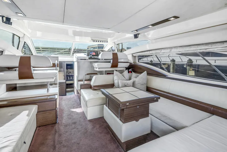 Liquidity Yacht Photos Pics Luxurious interior of a 2012 Azimut 48 Flybridge yacht with modern seating and elegant design.