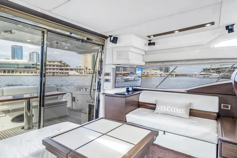 Liquidity Yacht Photos Pics Luxurious interior of 2012 Azimut 48 Flybridge yacht with waterfront view.