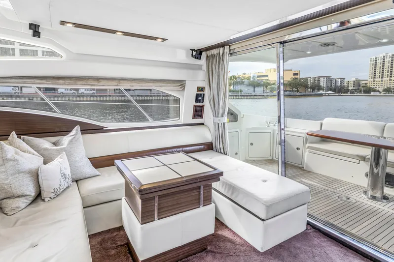 Liquidity Yacht Photos Pics Luxurious interior of a 2012 Azimut 48 Flybridge yacht with waterfront view.