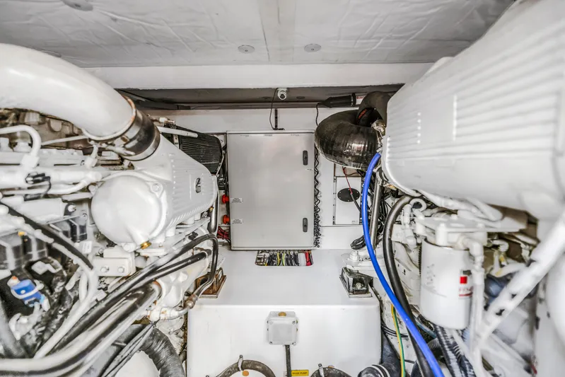 Liquidity Yacht Photos Pics Engine room of a 2012 Azimut 48 Flybridge yacht with visible machinery.