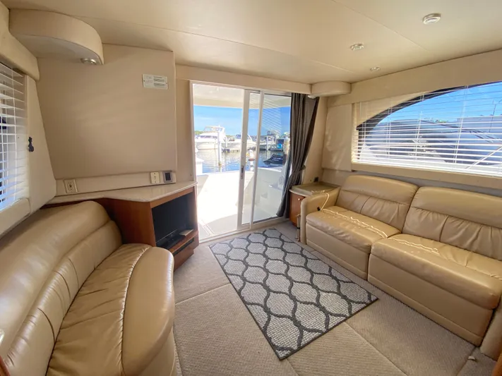  Yacht Photos Pics Luxurious interior of 2004 Meridian 381 Sedan yacht with leather seating and large windows.
