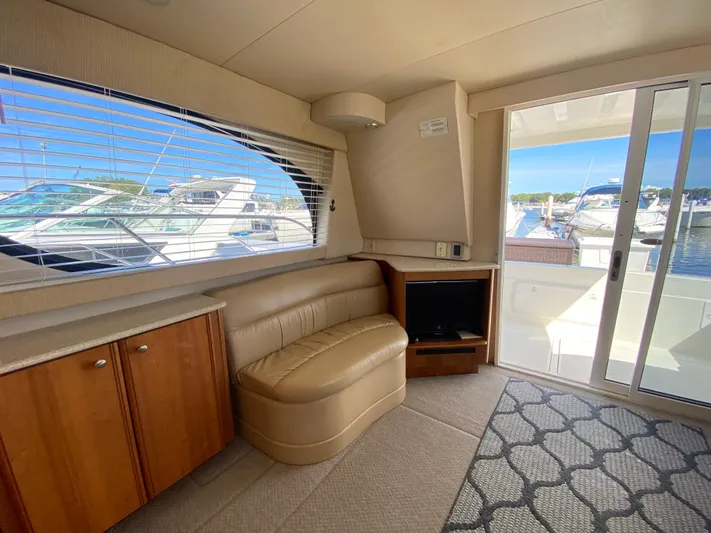  Yacht Photos Pics Interior of 2004 Meridian 381 Sedan yacht with leather seating and marina view.