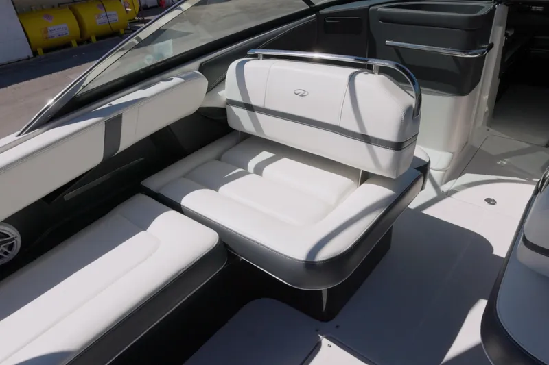  Yacht Photos Pics 2017 Regal 29 OBX boat interior with white cushioned seating and sleek design.