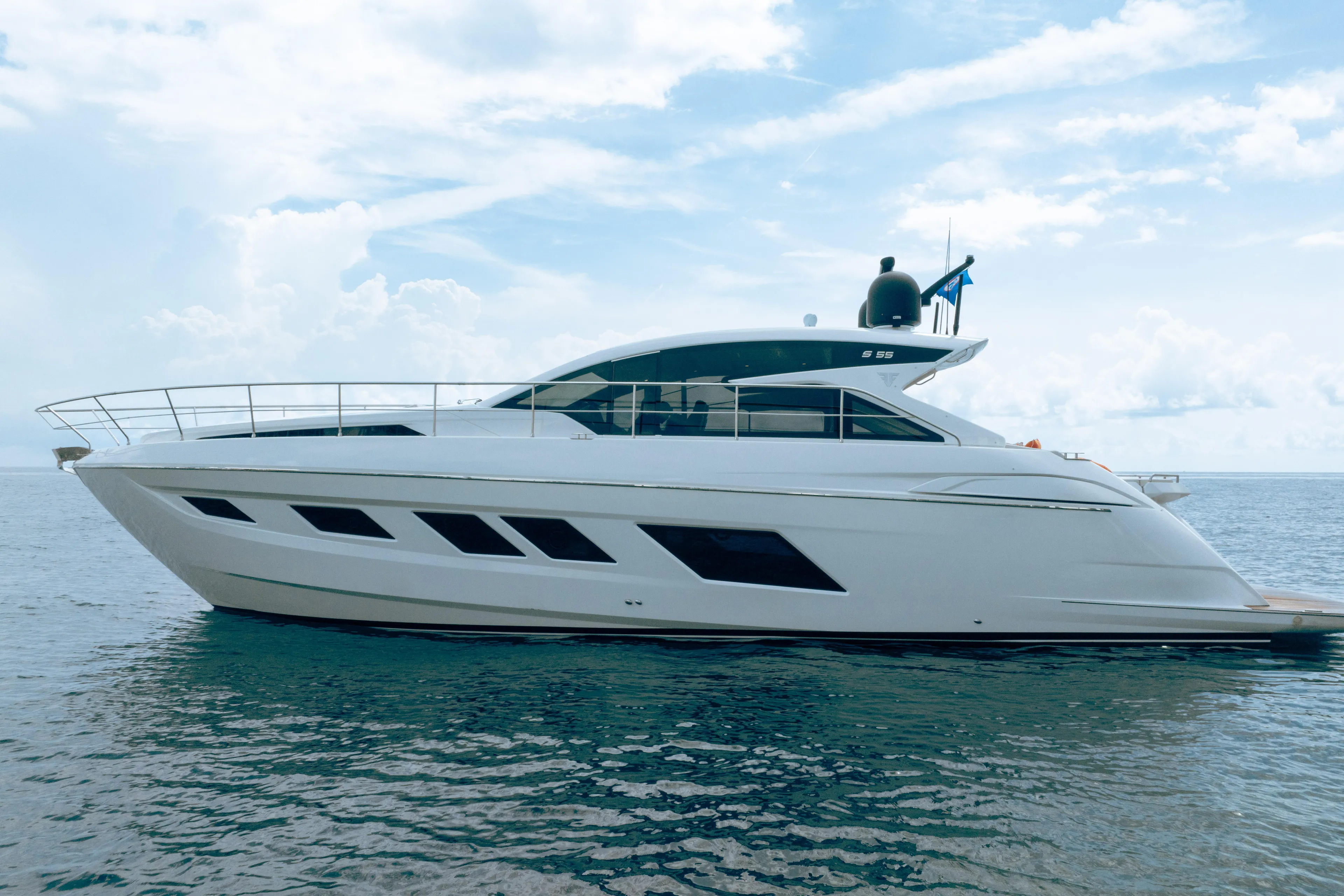 Juice Yacht Photos Pics 2019 Filippetti S55 yacht on calm ocean under blue sky.