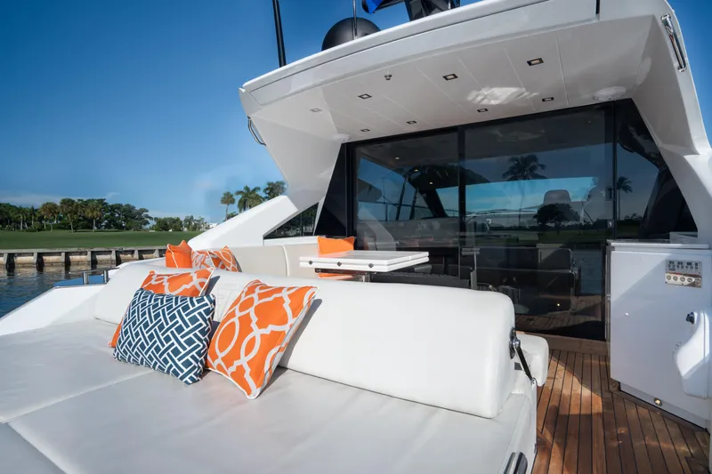 Juice Yacht Photos Pics Luxurious 2019 Filippetti S55 yacht with elegant outdoor seating and vibrant cushions.