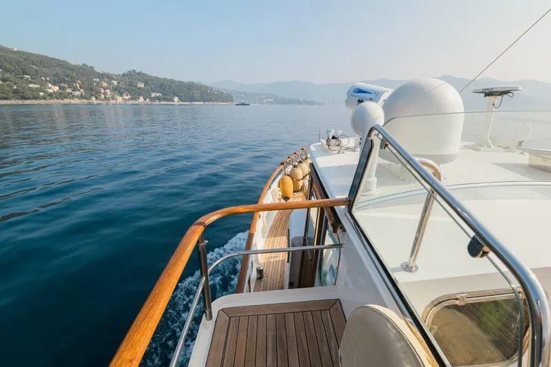 Yona Yacht Photos Pics 1981 Vripack Doggersbank 20 yacht cruising on calm waters near a scenic coastline.