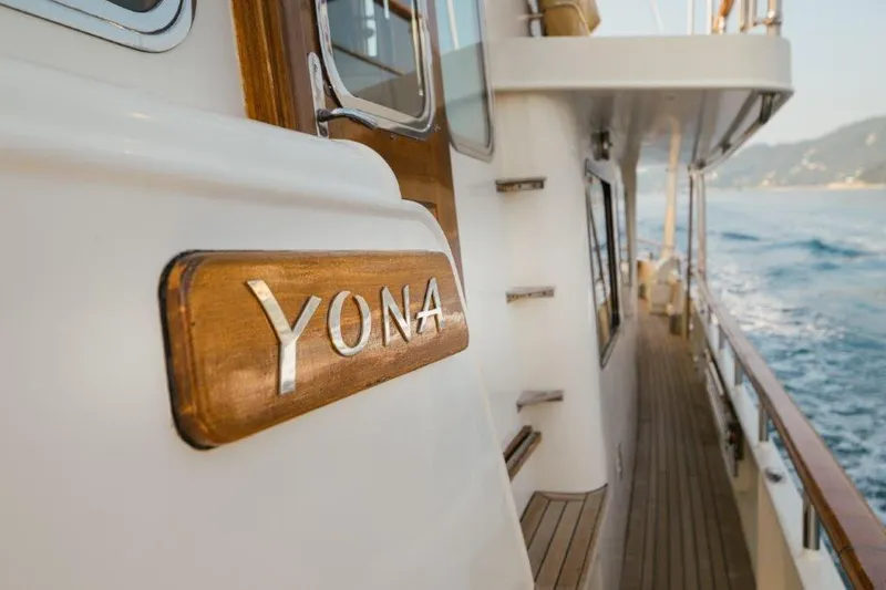 Yona Yacht Photos Pics 1981 Vripack Doggersbank 20 yacht, wooden nameplate "Yona," cruising on open water.