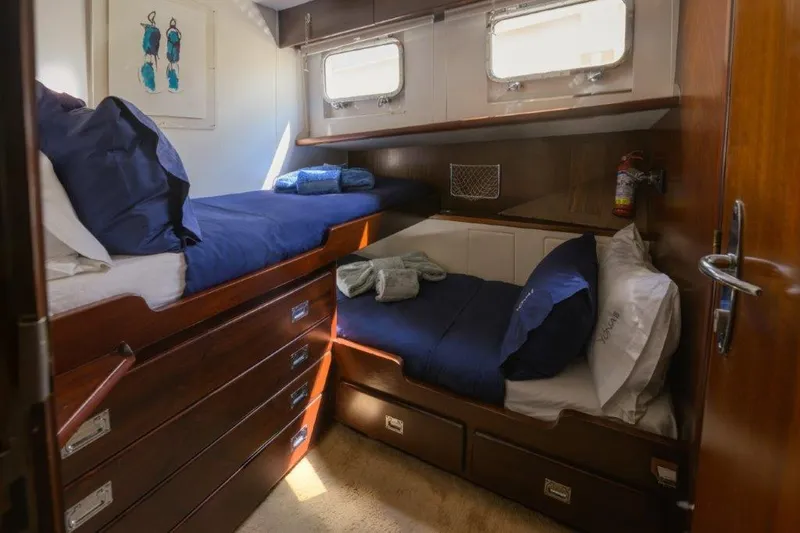 Yona Yacht Photos Pics Cozy cabin interior of 1981 Vripack Doggersbank 20 yacht with bunk beds and wooden storage.