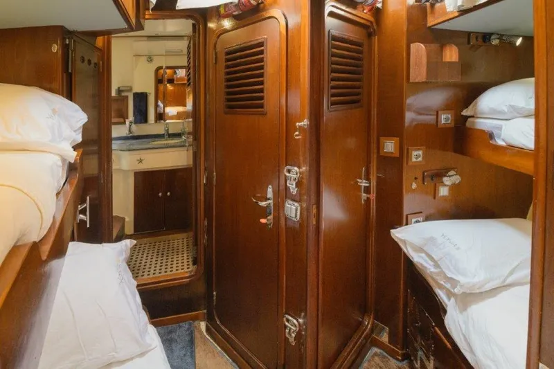 Yona Yacht Photos Pics Interior of 1981 Vripack Doggersbank 20 yacht with wooden finish and cozy sleeping quarters.
