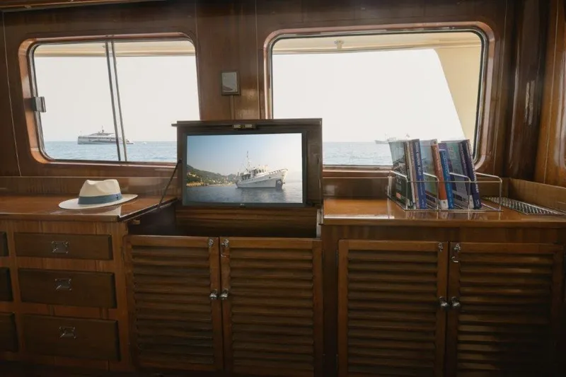 Yona Yacht Photos Pics Interior of 1981 Vripack Doggersbank 20 yacht with wooden cabinets and sea view.