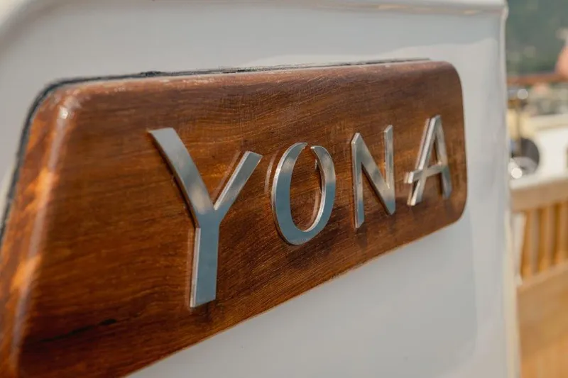 Yona Yacht Photos Pics "Yona" nameplate on 1981 Vripack Doggersbank 20 yacht, wooden and metallic design.