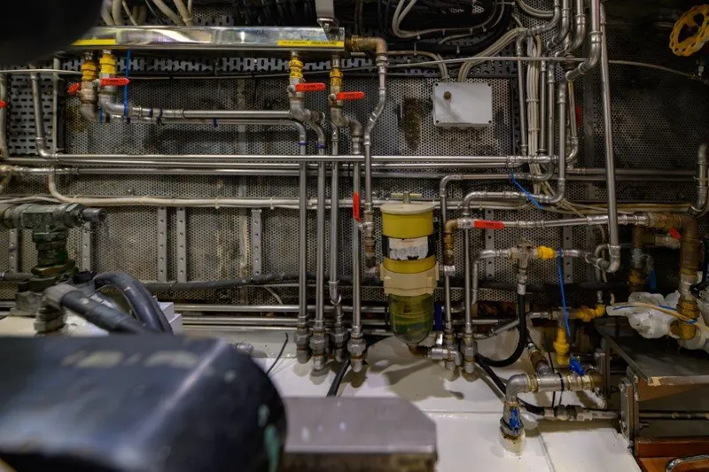 Yona Yacht Photos Pics Engine room of 1981 Vripack Doggersbank 20 with complex piping and machinery.