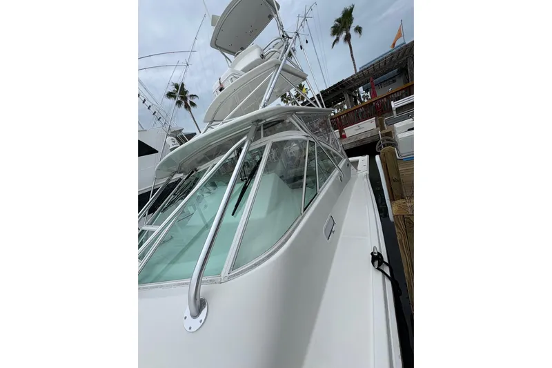 Reelity Check Yacht Photos Pics 2004 Cabo 40 Hardtop Express yacht docked, showcasing sleek design and modern features.