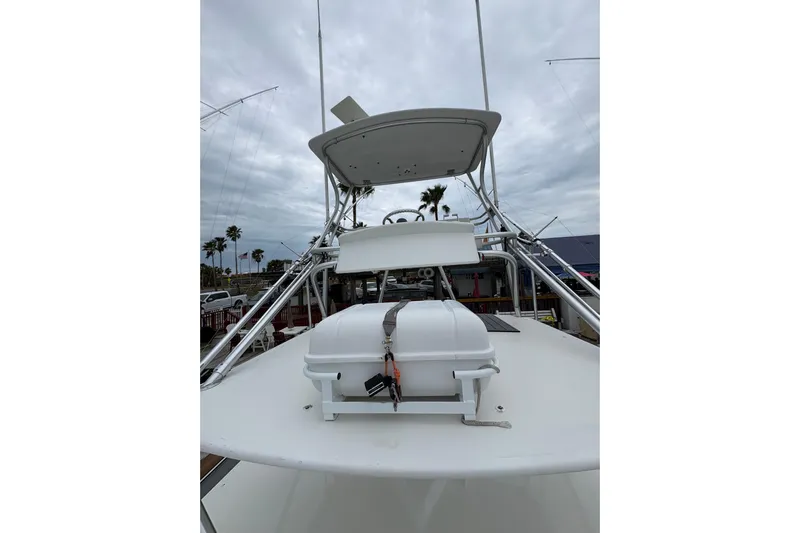 Reelity Check Yacht Photos Pics 2004 Cabo 40 Hardtop Express boat with tower and equipment on deck.