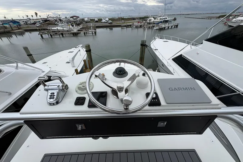 Reelity Check Yacht Photos Pics Helm of 2004 Cabo 40 Hardtop Express with Garmin navigation, docked at marina.