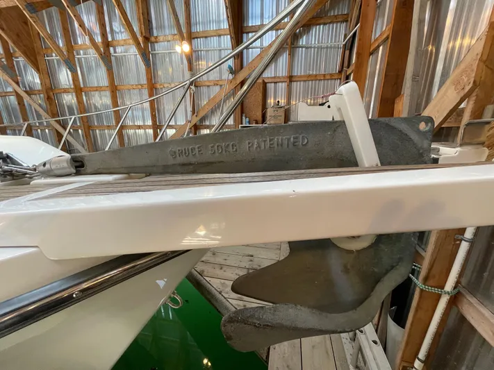 Wind Star Yacht Photos Pics 1993 Ocean Alexander 520 Pilothouse anchor in a wooden boathouse setting.