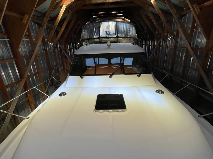 Wind Star Yacht Photos Pics 1993 Ocean Alexander 520 Pilothouse yacht in a wooden boathouse.