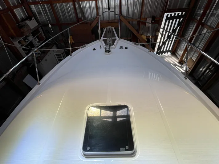 Wind Star Yacht Photos Pics 1993 Ocean Alexander 520 Pilothouse yacht bow in storage, featuring a sleek deck design.