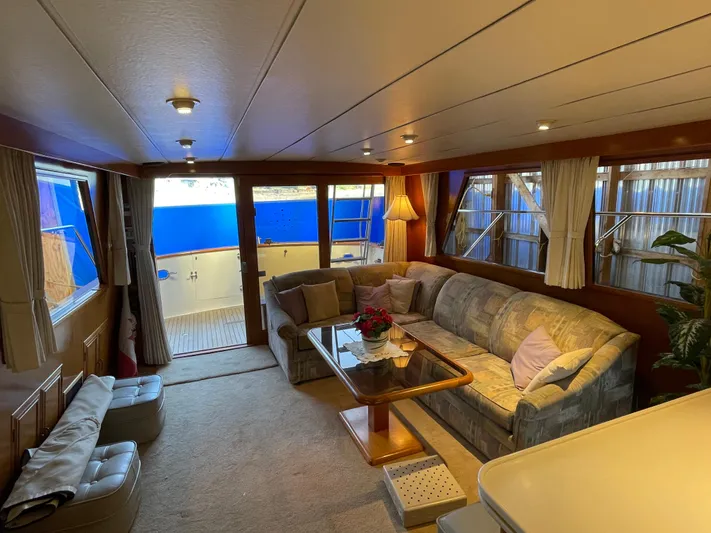 Wind Star Yacht Photos Pics Luxurious interior of 1993 Ocean Alexander 520 Pilothouse yacht with cozy seating and elegant decor.
