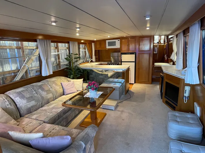 Wind Star Yacht Photos Pics Luxurious interior of 1993 Ocean Alexander 520 Pilothouse yacht with cozy seating and modern amenities.