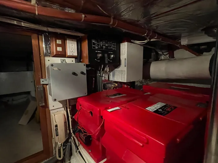 Wind Star Yacht Photos Pics Engine room of 1993 Ocean Alexander 520 Pilothouse with red machinery and control panels.